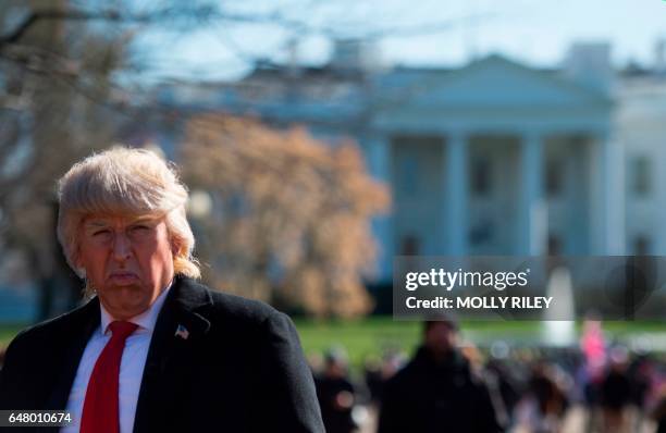 Political impersonator Dustin Gold, marches as Donald Trump outside the White House during a pro-Trump rally on March 4 in Washington, DC.