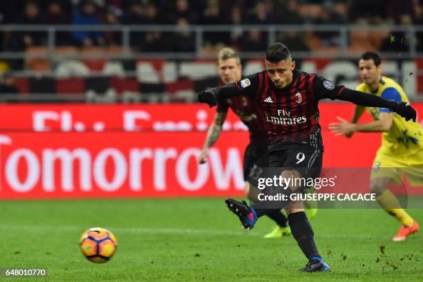 Milan's forward from Italy Gianluca Lapadula kicks and scores a penalty during the Italian Serie A football match AC Milan vs Chievo at "San Siro"...