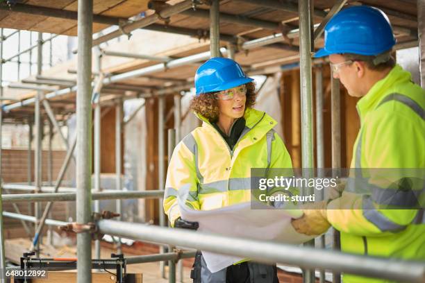 construction site meeting - scaffolding stock pictures, royalty-free photos & images
