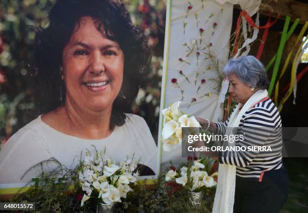 The president of the NGO Committee of Relatives of the Disappeared in Honduras , Bertha Oliva, lays a wreath on an alter in memory of murdered...