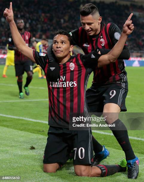 Carlos Bacca of AC Milan celebrates his second goal with his team-mate Gianluca Lapadula during the Serie A match between AC Milan and AC...