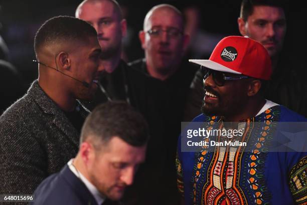 Boxers Anthony Joshua and Dereck Chisora in discussion at ringside at The O2 Arena on March 4, 2017 in London, England.