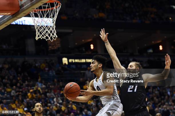 Markus Howard of the Marquette Golden Eagles takes a shot in front of Isaiah Zierden of the Creighton Bluejays during the second half of a game at...