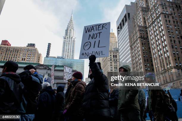 People take part of a protest against the planned Dakota Access Pipeline in North Dakota on March 04, 2017 in New York.
