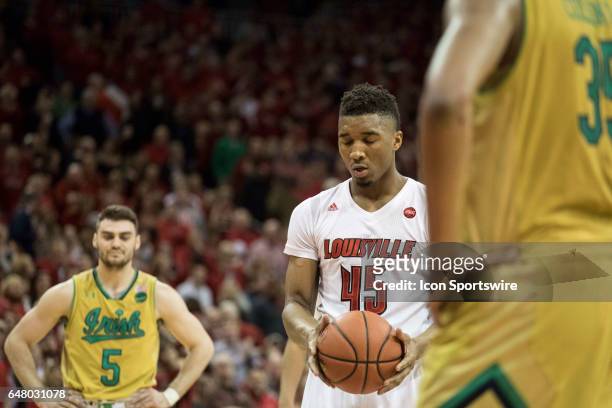 Louisville Cardinals guard Donovan Mitchell shoots a free throw in the second half during a men's college basketball game between Notre Dame Irish...