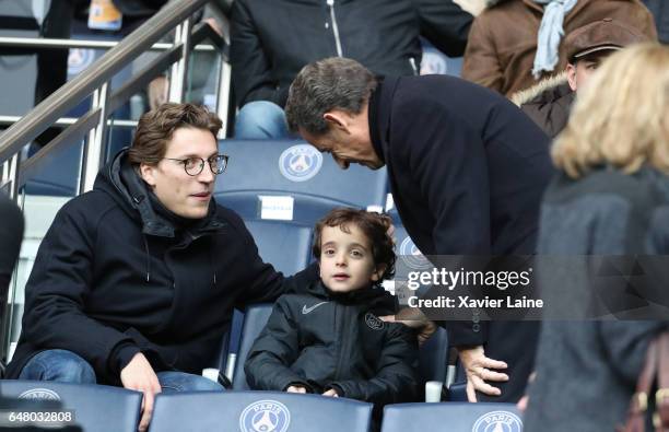 French Politician Nicolas Sarkozy and his son Jean Sarkozy and grandson Solal Sarkozy attend the French Ligue 1 match between Paris Saint-Germain and...