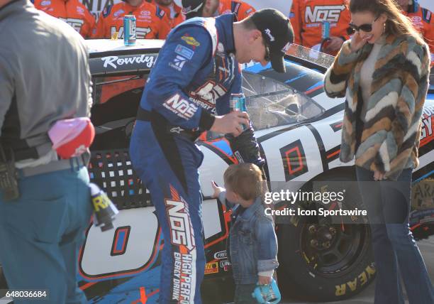 Race winner Kyle Busch Joe Gibbs Racing NOS Energy Toyota Camry celebrating with his on son Brexton and wife Samantha after the Xfinity Series Rinnai...