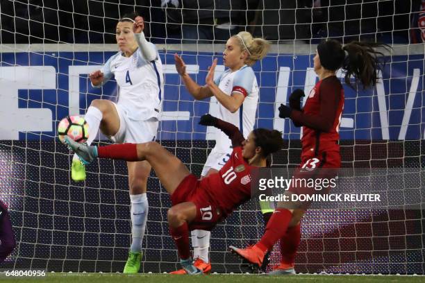 England's Lucy Bronze and United States' Carli Lloyd battle for the ball as the United States and England women's national teams play in the...