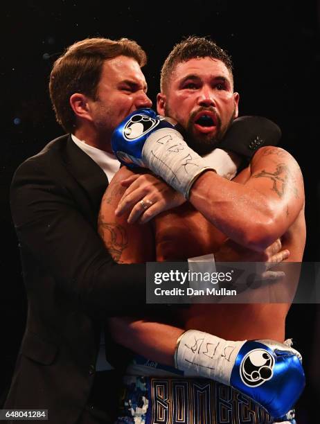 Tony Bellew celebrates an 11th round TKO victory over David Haye with promoter Eddie Hearn after their Heavyweight contest at The O2 Arena on March...