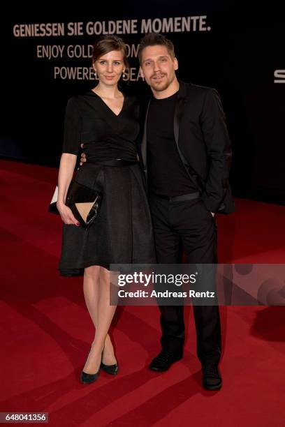 Hanno Koffler and partner arrive for the Goldene Kamera on March 4, 2017 in Hamburg, Germany.