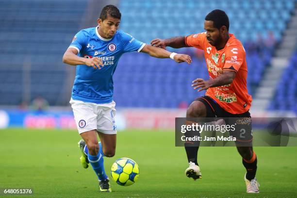 Joao Rojas of Cruz Azul and Brayan Angulo of Jaguares fight for the ball during the 9th round match between Cruz Azul and Chiapas as part of the...