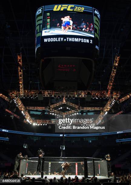 Albert Morales pushes Andre Soukhamthath up against the cage in their bantamweight bout during the UFC 209 event at T-Mobile arena on March 4, 2017...