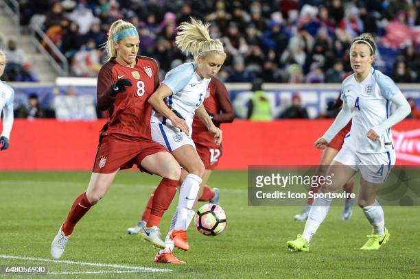 Defender Julie Johnston attempts to steal the ball from England defender Steph Houghton in the second half of SheBelieves Cup on March 04 at Red Bull...