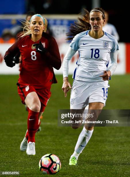 Jill Scott of England and Julie Johnston of USA chase the ball during the 2017 SheBelieves Cup at Red Bull Arena on March 4, 2017 in Harrison, New...