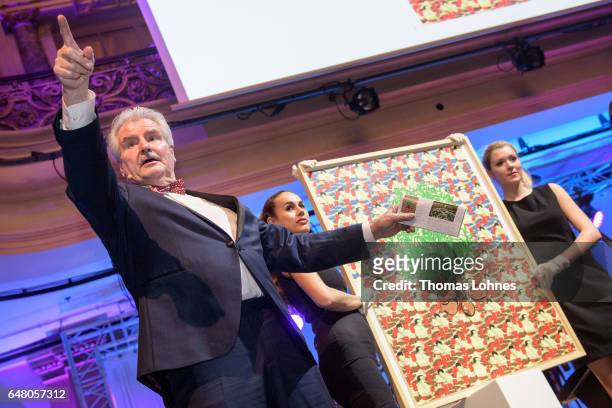 Frank Lehmann auctions the graphic "potato counter" of the artist Thomas Bayrlethe Spring Ball Frankfurt 2017 on March 4, 2017 in Frankfurt am Main,...