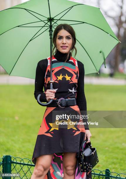 Camila Coelho wearing a dress outside Elie Saab on March 4, 2017 in Paris, France.