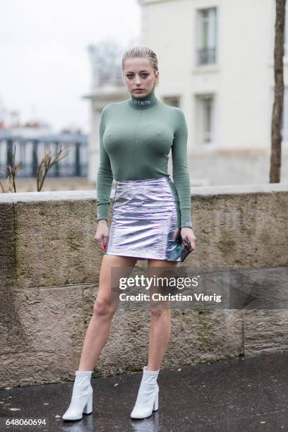 Caroline Vreeland wearing a tight longshirt, silver mini skirt outside Mugler on March 4, 2017 in Paris, France.