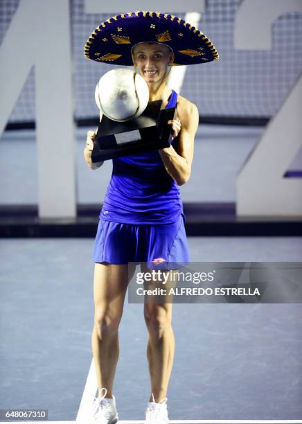 Ukranian tennis player Lesia Tsurenko poses with the trophy after winning the Mexican Tennis Open WTA final match against French Kristina Mladenovic...
