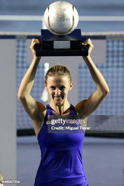 March 04: Lesia Tsurenko celebrates with the champions trophy after winning the Final match between Lesia Tsurenko and Kristina Mladenovic as part of...