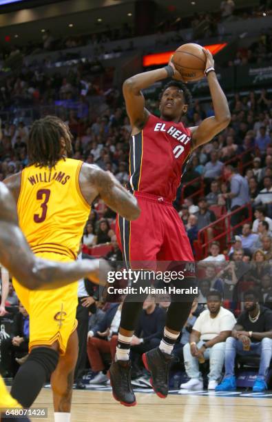 Miami Heat guard Josh Richardson shoots over Cleveland Cavaliers forward Derrick Williams during the first quarter of an NBA basketball game at...