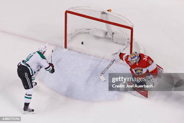 Jamie Benn of the Dallas Stars scores a goal past goaltender James Reimer of the Florida Panthers during first period action at the BB&T Center on...