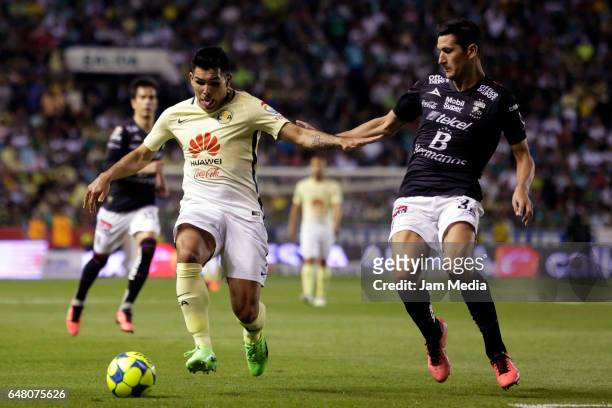 Michael Arroyo of America and Guillermo Burdisso of Leon fight for the ball during the 9th round match between Leon and America as part of the Torneo...
