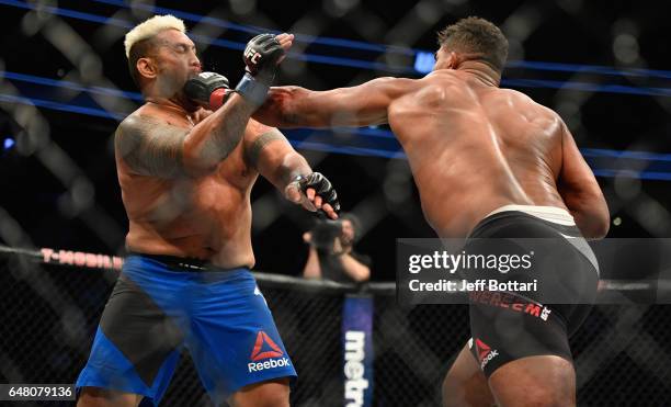 Alistair Overeem of the Netherlands punches Mark Hunt of New Zealand in their heavyweight bout during the UFC 209 event at T-Mobile Arena on March 4,...