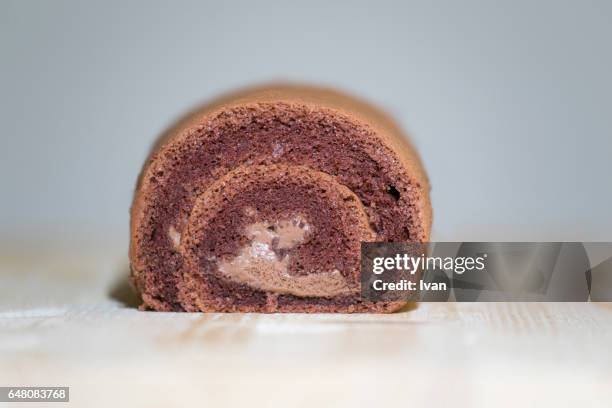 chocolate roll with cream - christmas log stock pictures, royalty-free photos & images