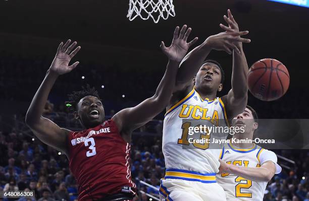 Ike Anigbogu of the UCLA Bruins and Robert Franks of the Washington State Cougars battle for a rebound in the first half of the game at Pauley...