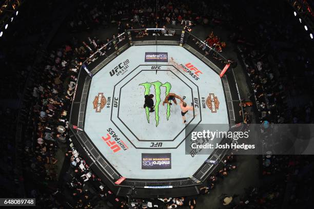 An overhead view of the Octagon as Rashad Evans punches Daniel Kelly of Australia in their middleweight bout during the UFC 209 event at T-Mobile...