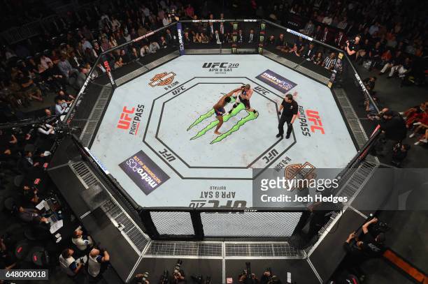 An overhead view of the Octagon as Rashad EvanRashad Evans punches Daniel Kelly of Australia in their middleweight bout during the UFC 209 event at...