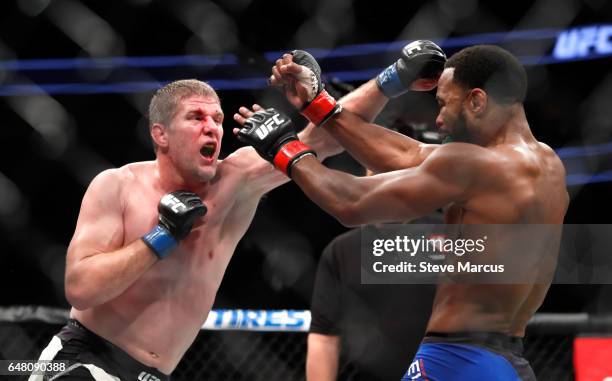 Daniel Kelly of Australia battles with Rashad Evans in a middleweight bout during UFC 209 at T-Mobile Arena on March 4, 2017 in Las Vegas, Nevada....