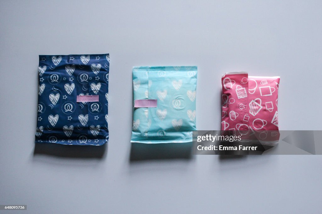 Sanitary towels in coloured wraps