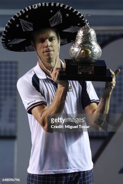 March 04: Sam Querrey holds up the trophy after winning the Final match between Sam Querrey and Rafael Nadal as part of the Abierto Mexicano Telcel...