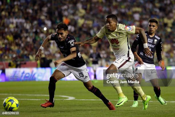 Carlos Guzman of Leon and Michael Arroyo of America fight for the ball during the 9th round match between Leon and America as part of the Torneo...