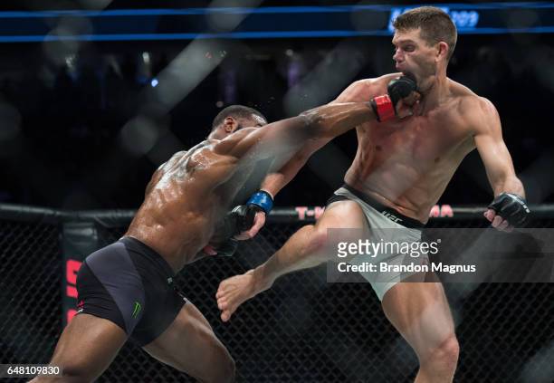 Tyron Woodley punches Stephen Thompson in their welterweight championship bout during the UFC 209 event at T-Mobile arena on March 4, 2017 in Las...