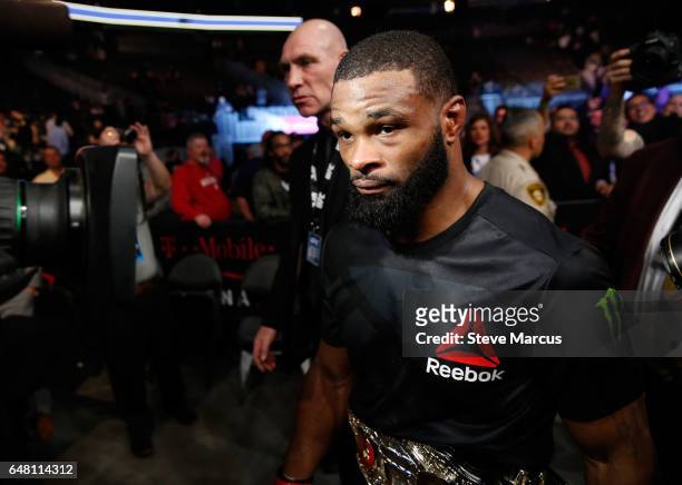 Welterweight champion Tyron Woodley, leaves the Octagon after his title defense against Stephen Thompson at UFC 209 on March 4, 2017 in Las Vegas,...