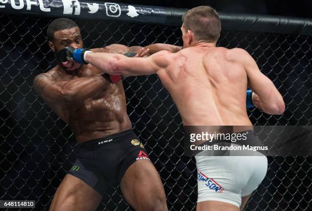 Stephen Thompson punches Tyron Woodley in their welterweight championship bout during the UFC 209 event at T-Mobile arena on March 4, 2017 in Las...