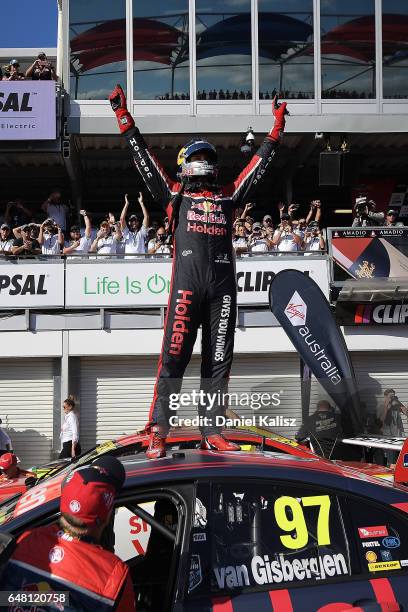 Shane Van Gisbergen driver of the Red Bull Holden Racing Team Holden Commodore VF celebrates after winning race 2 for the Clipsal 500, which is part...