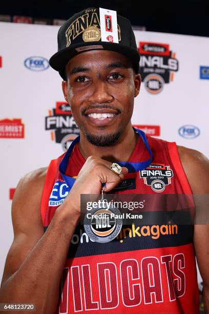 Bryce Cotton of the Wildcats celebrates after being awarded Finals MVP and winning game three and the NBL Grand Final series between the Perth...