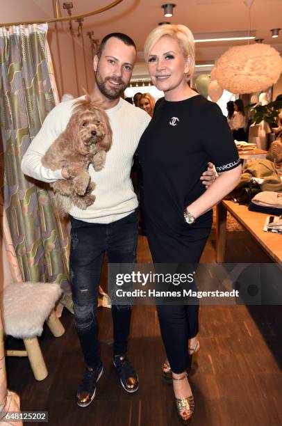 Fashion designer Marcell von Berlin with dog Mucki and Claudia Effenberg during 'Marcell von Berlin Store Opening' on March 4, 2017 in Munich,...