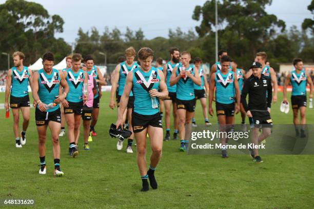 Port Adelaide players leave the field after losing in the 2017 JLT Community Series AFL match between the Port Adelaide Power and the Richmond Tigers...