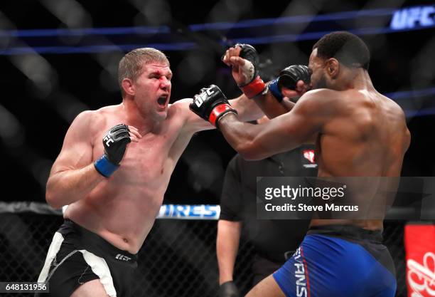 Middleweight Daniel Kelly of Australia punches Rashad Evans during UFC 209 at T-Mobile Arena on March 4, 2017 in Las Vegas, Nevada. Kelly won the...