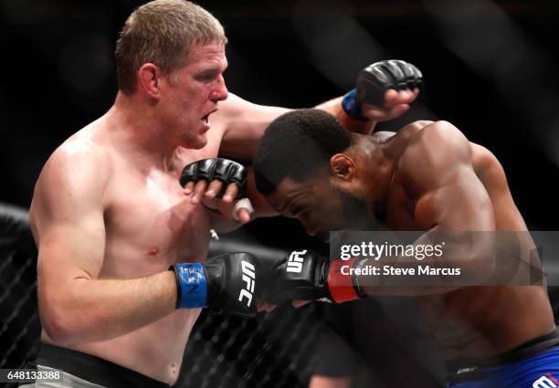 Daniel Kelly of Australia mixes it up with Rashad Evans during UFC 209 at T-Mobile Arena on March 4, 2017 in Las Vegas, Nevada. Kelly won the fight...