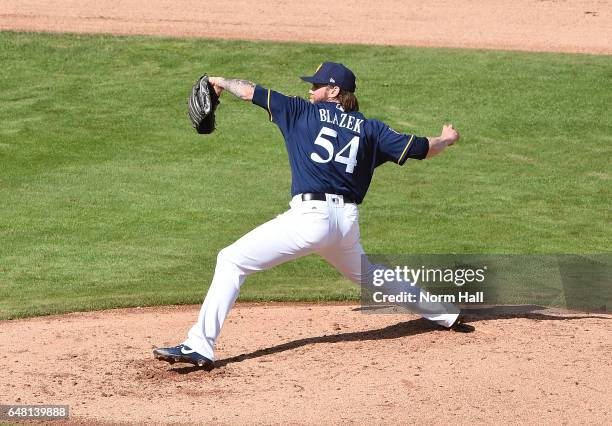 Michael Blazek of the Milwaukee Brewers delivers a pitch against the Kansas City Royals at Maryvale Baseball Park on February 28, 2017 in Phoenix,...