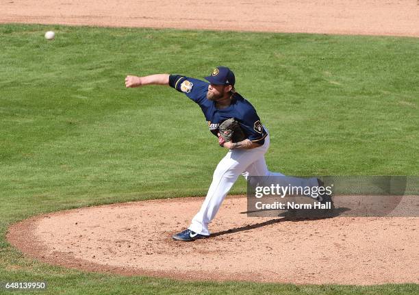 Michael Blazek of the Milwaukee Brewers delivers a pitch against the Kansas City Royals at Maryvale Baseball Park on February 28, 2017 in Phoenix,...