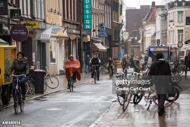 People cycle and walk along a street on February 23, 2017 in Groningen, Netherlands. The Dutch will vote in parliamentary elections on March 15 in a...