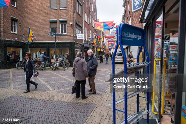 People chat in a shopping street on February 21, 2017 in Venlo, Netherlands. The Dutch will vote in parliamentary elections on March 15 in a contest...