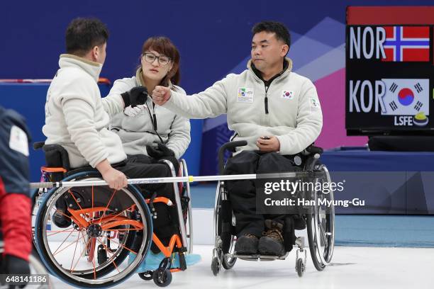 Lee Dong-Ha, Cho Min-Kyong and Cha Jae-Goan from South Korea react during the World Wheelchair Curling Championship 2017 - test event for PyeongChang...