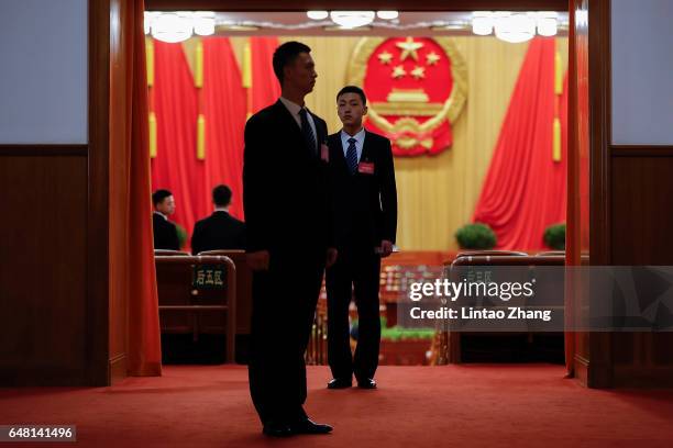 Chinese armed police guards inside the Great Hall of the People before the opening session of the National People's Congress on March 5, 2017 in...